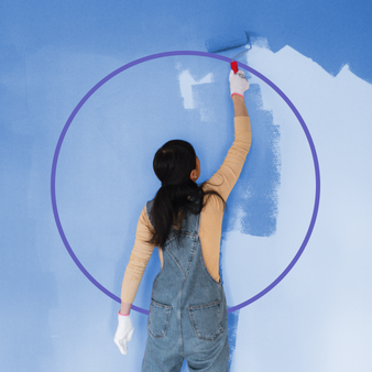 Woman painting a wall